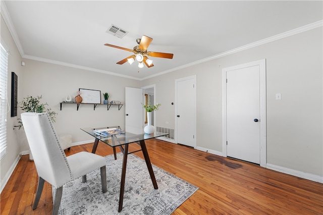 office area with ceiling fan, visible vents, and light wood-style flooring