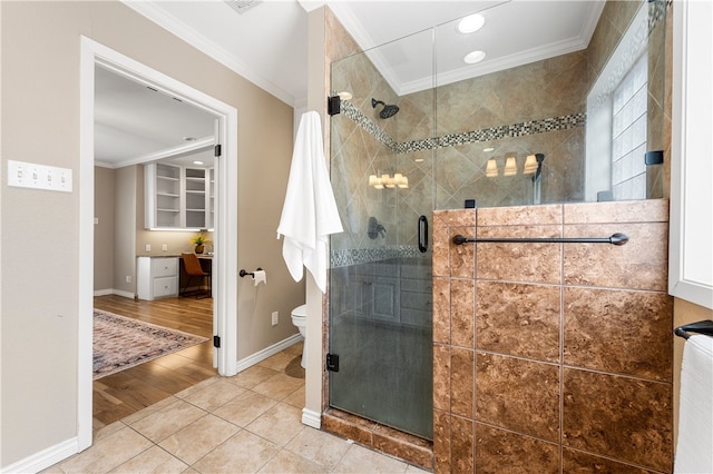 full bathroom with crown molding, toilet, a stall shower, and tile patterned floors