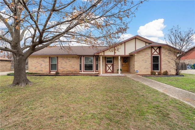 ranch-style home featuring a front yard