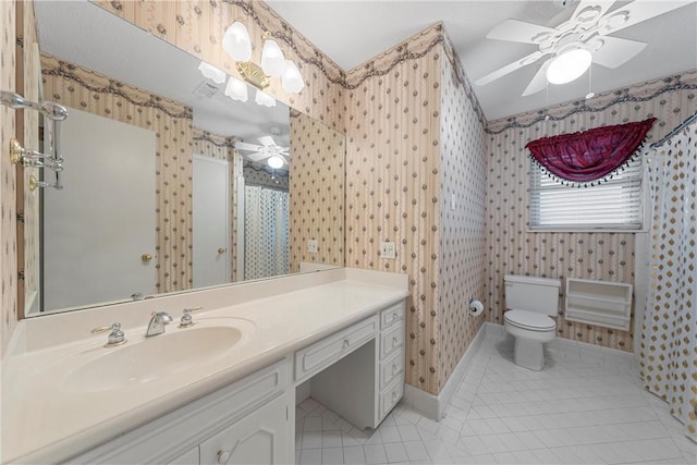 bathroom featuring tile patterned flooring, vanity, toilet, and ceiling fan