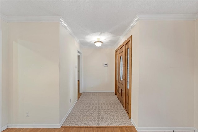 corridor featuring wood-type flooring, a textured ceiling, and ornamental molding