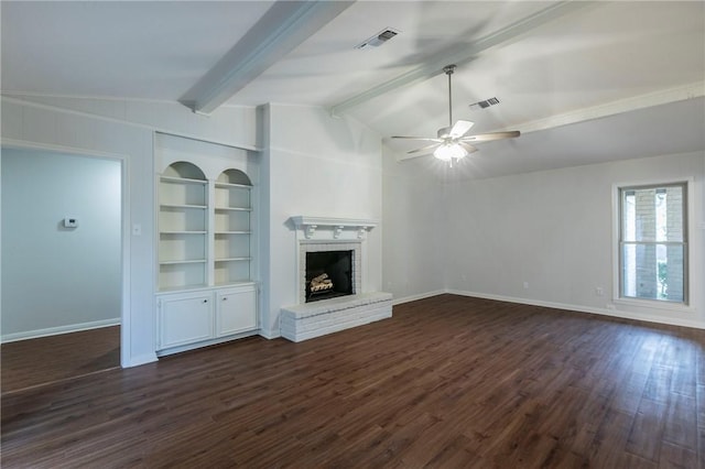 unfurnished living room with lofted ceiling with beams, ceiling fan, dark hardwood / wood-style flooring, and a brick fireplace