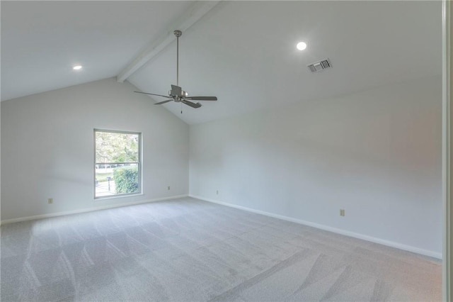 carpeted empty room with lofted ceiling with beams and ceiling fan