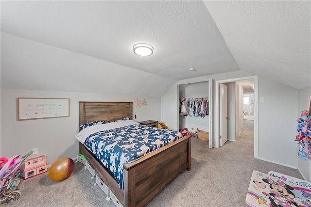 bedroom featuring lofted ceiling, light carpet, and a textured ceiling