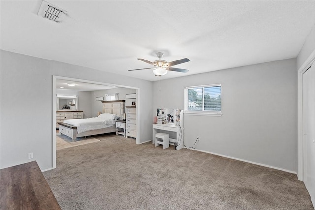 unfurnished bedroom with ceiling fan and carpet floors