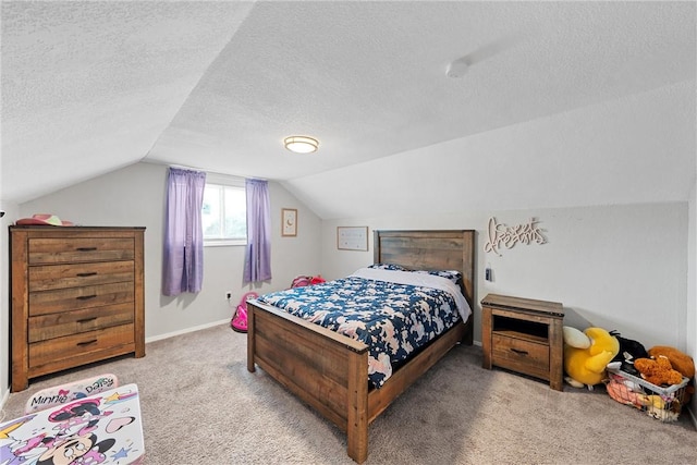 bedroom featuring vaulted ceiling, a textured ceiling, and carpet