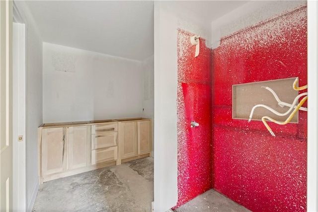 bathroom featuring concrete flooring