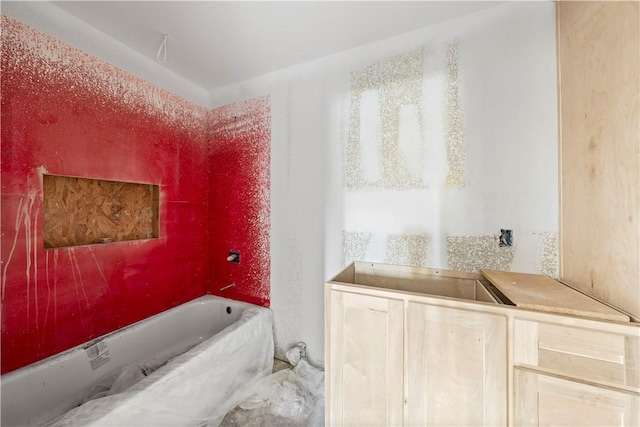 bathroom featuring a tub