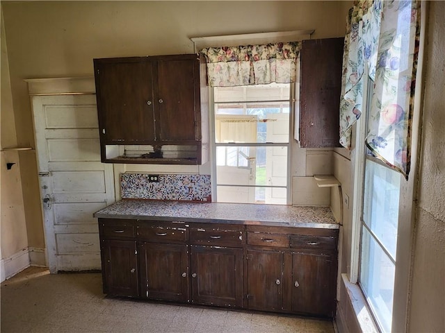 kitchen featuring dark brown cabinets