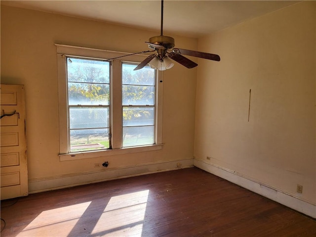 spare room featuring ceiling fan and hardwood / wood-style floors