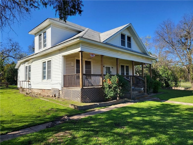 view of front of house featuring a front lawn and covered porch