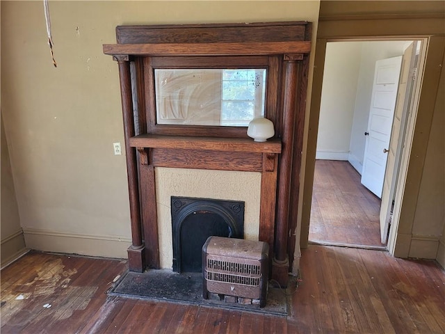 interior details featuring hardwood / wood-style floors and heating unit