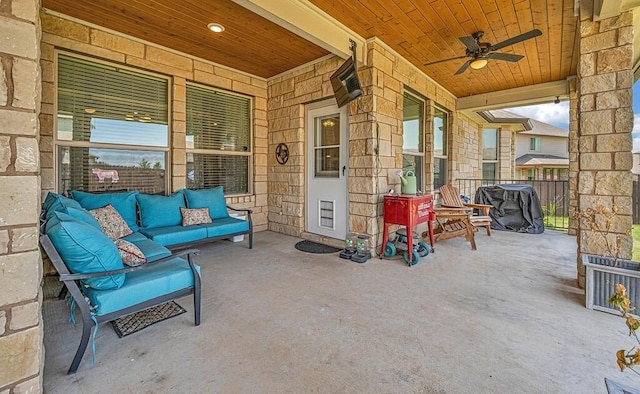 view of patio with a porch, an outdoor living space, and ceiling fan