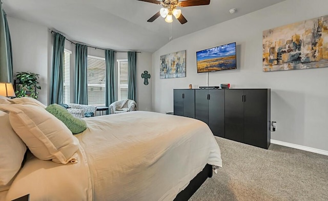 carpeted bedroom with vaulted ceiling and ceiling fan