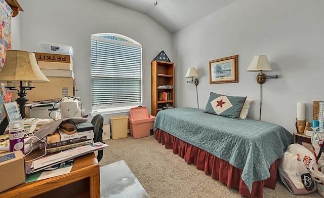 carpeted bedroom with vaulted ceiling