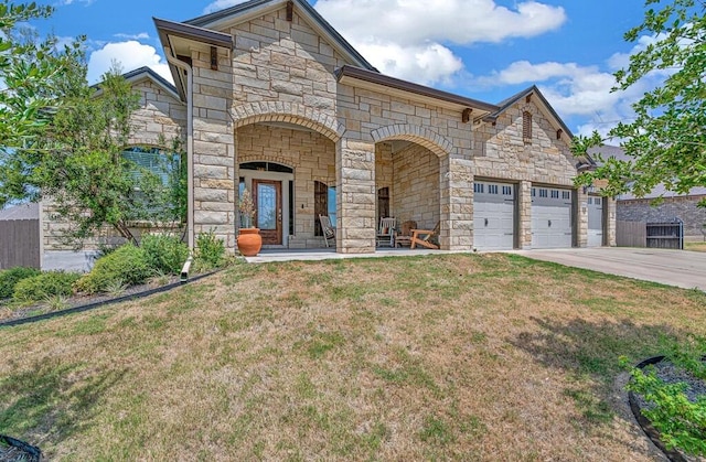 view of front of house featuring a front yard and a garage