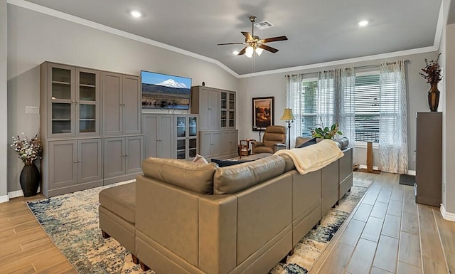 living room with crown molding, ceiling fan, light hardwood / wood-style floors, and vaulted ceiling