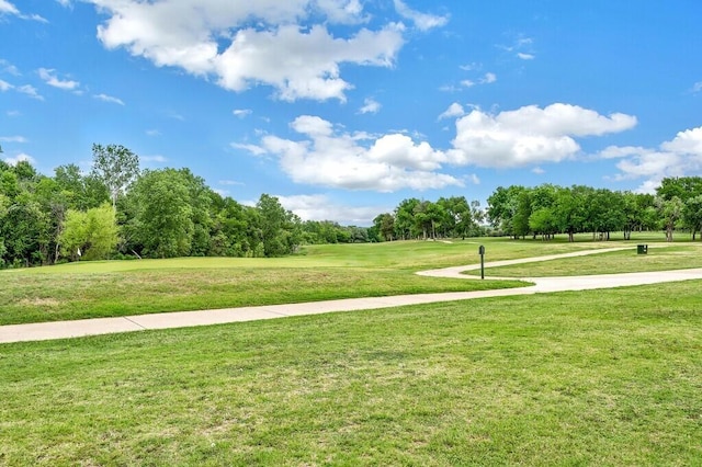 surrounding community featuring a yard