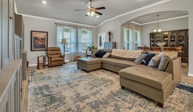 living room with crown molding, light hardwood / wood-style floors, and ceiling fan with notable chandelier