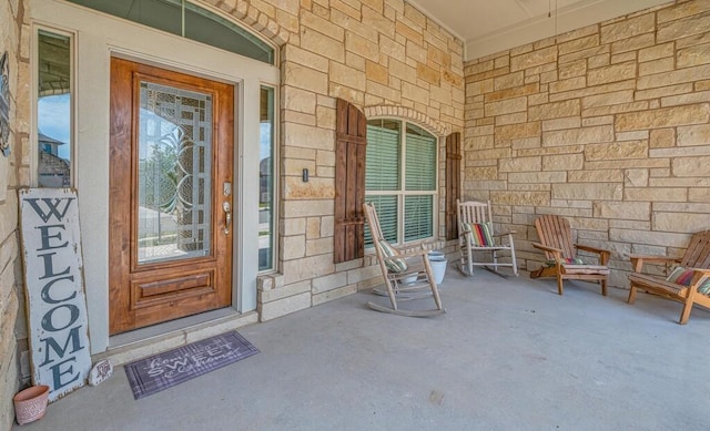 doorway to property with covered porch