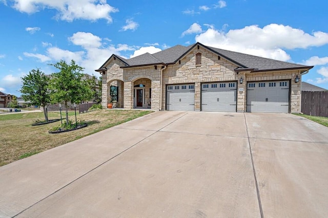 view of front facade with a garage and a front yard