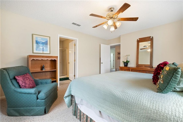 bedroom with a textured ceiling, ceiling fan, and carpet flooring