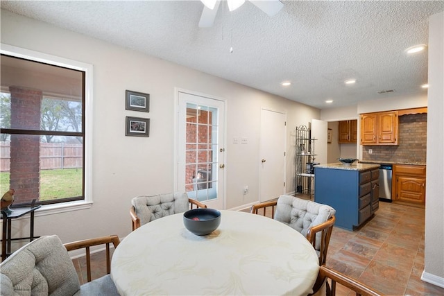 dining space with a textured ceiling