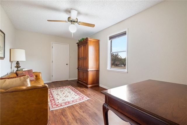 office area with hardwood / wood-style floors, a textured ceiling, and ceiling fan