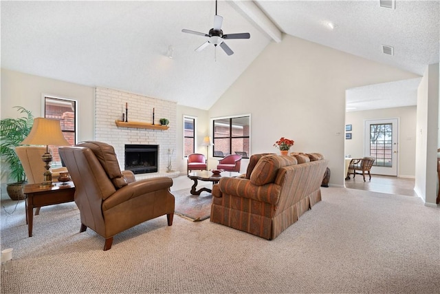 living room featuring high vaulted ceiling, light carpet, a brick fireplace, ceiling fan, and beam ceiling