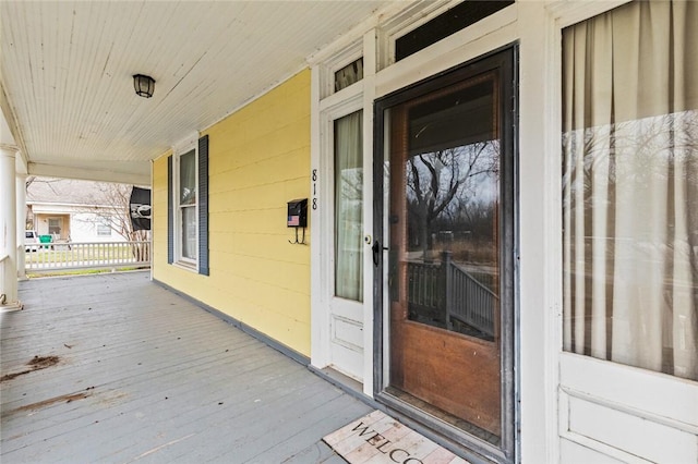 entrance to property featuring a porch