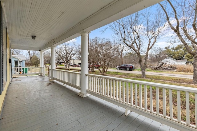 wooden terrace featuring covered porch