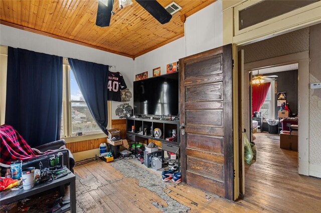 rec room with visible vents, wood ceiling, ceiling fan, and hardwood / wood-style flooring