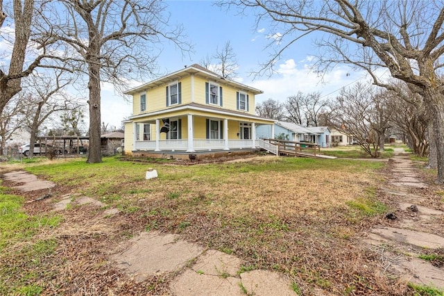 view of front facade featuring a porch and a front lawn