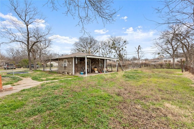 view of yard with an outdoor structure and fence