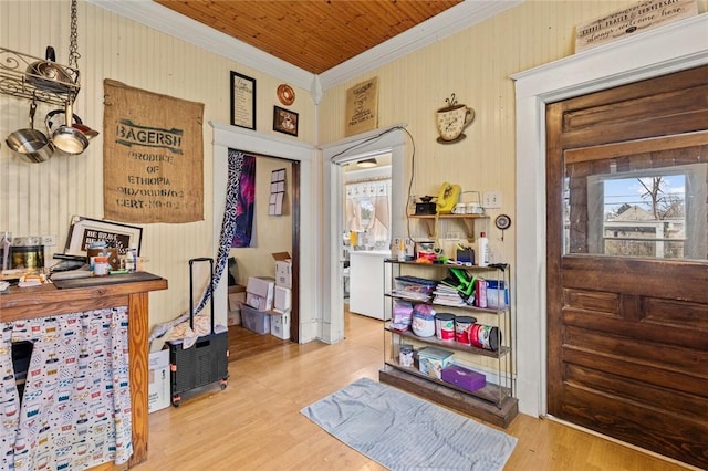 interior space featuring wood finished floors and ornamental molding