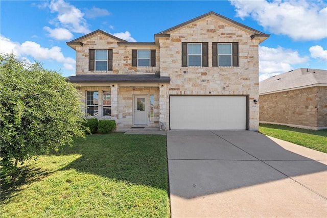 view of front of home featuring a front yard and a garage