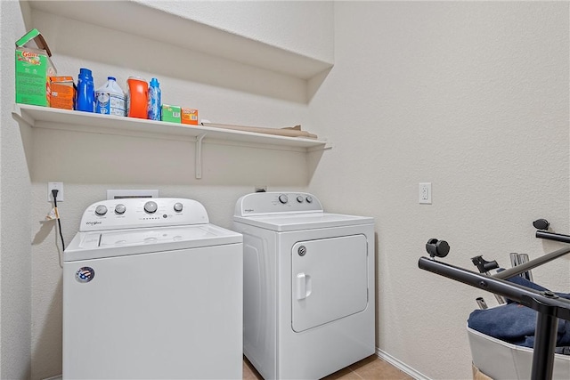 laundry area with washing machine and dryer