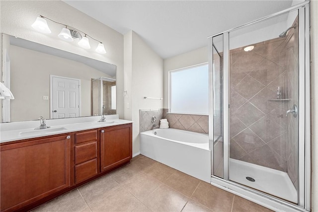 bathroom with tile patterned floors, vanity, and independent shower and bath