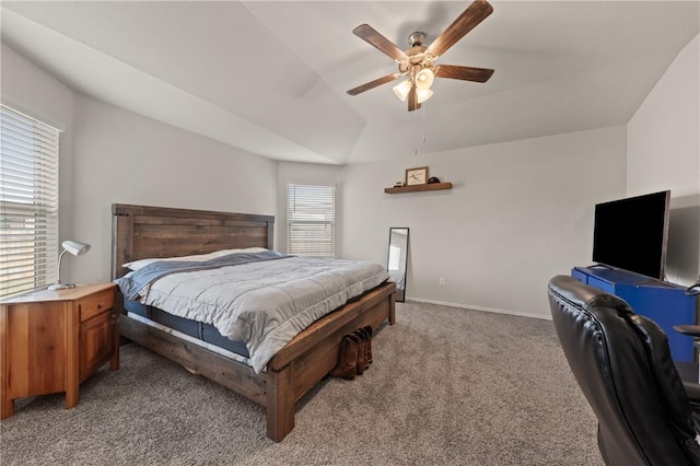 bedroom featuring baseboards, ceiling fan, lofted ceiling, and light colored carpet