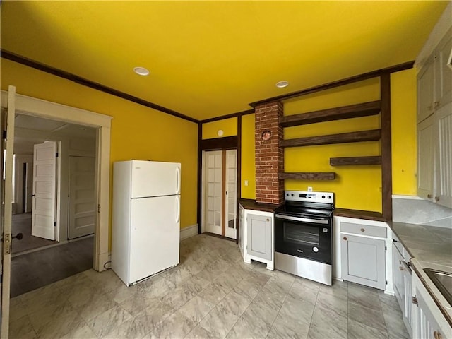 kitchen featuring ornamental molding, sink, white cabinets, white fridge, and stainless steel electric range oven