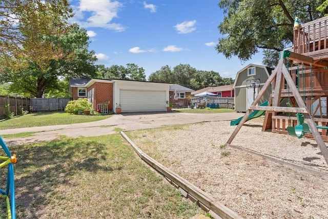 view of play area featuring a yard and an outdoor structure