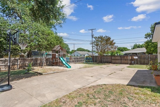 view of playground featuring a patio area