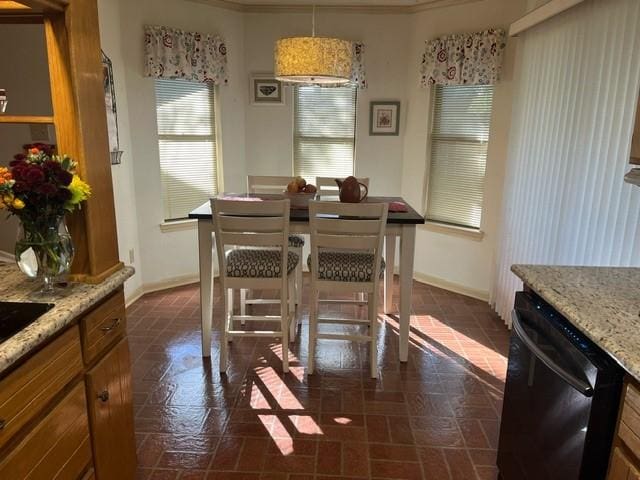 dining room featuring crown molding