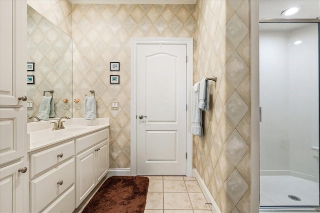 bathroom with vanity, an enclosed shower, and tile patterned floors