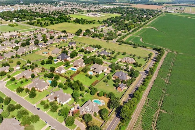 drone / aerial view featuring a rural view and a water view