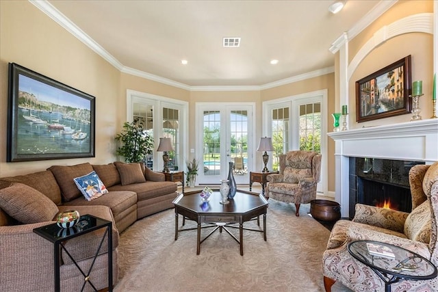 living room featuring a fireplace, ornamental molding, and french doors