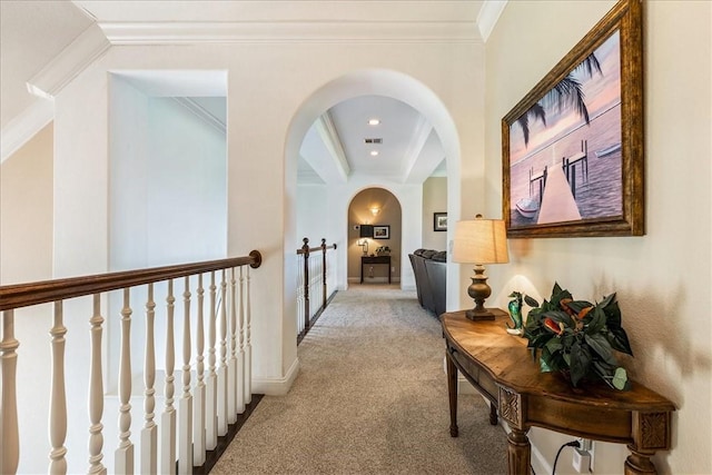 hall featuring crown molding and light carpet