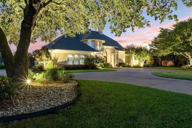 view of front of house with a lawn