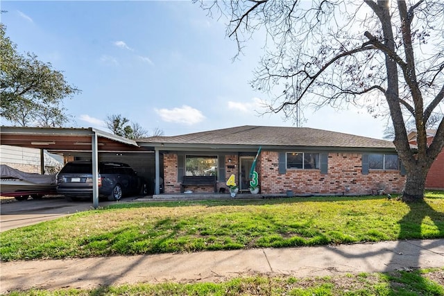 ranch-style home with a carport and a front lawn