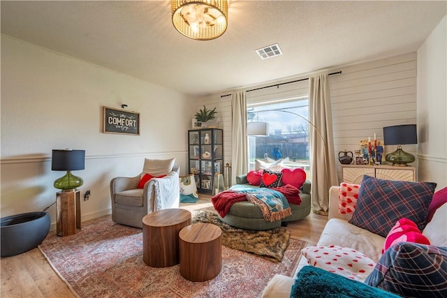 sitting room featuring hardwood / wood-style floors